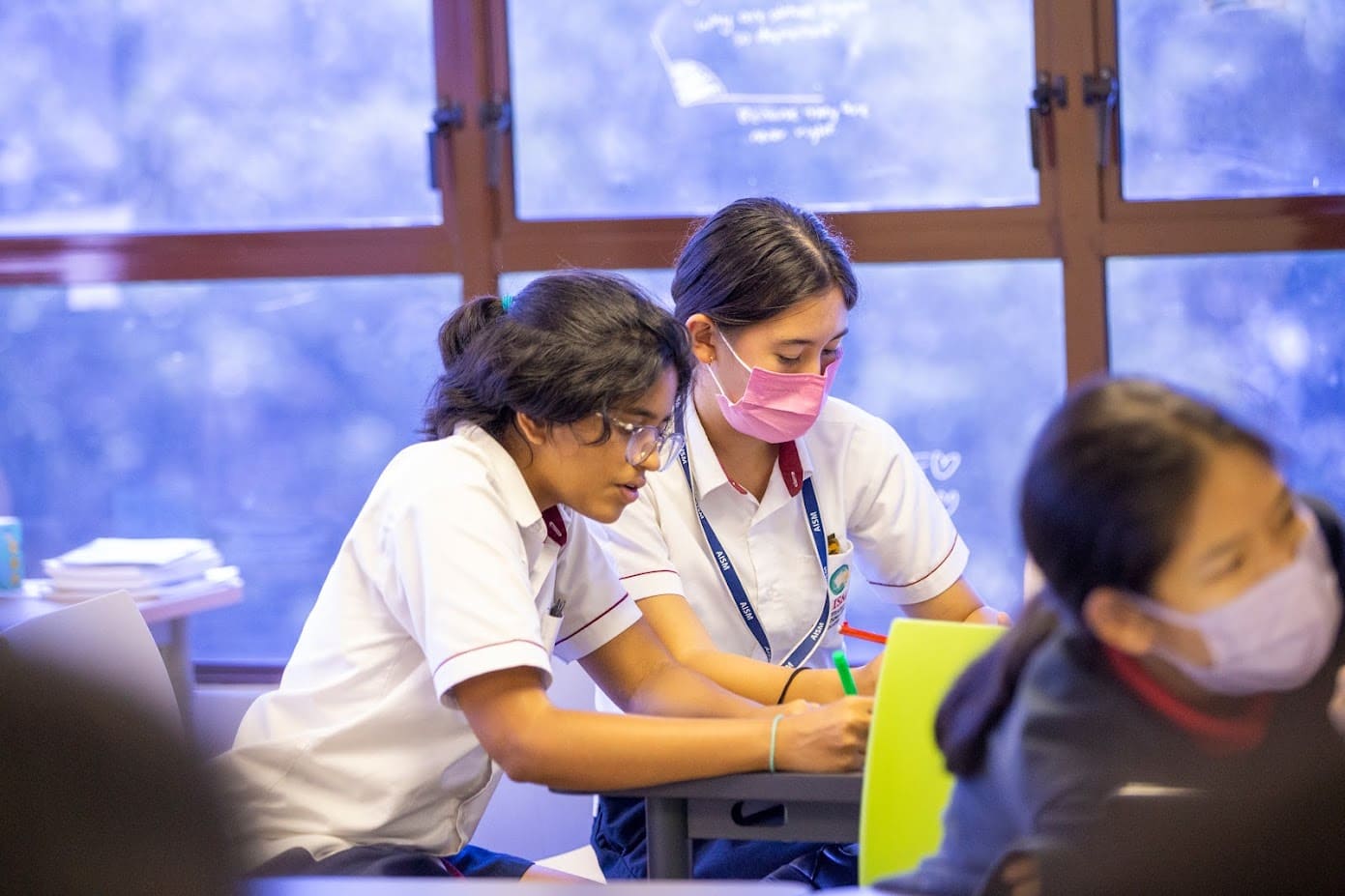 Students participating in school activities for English language learning and development skills.